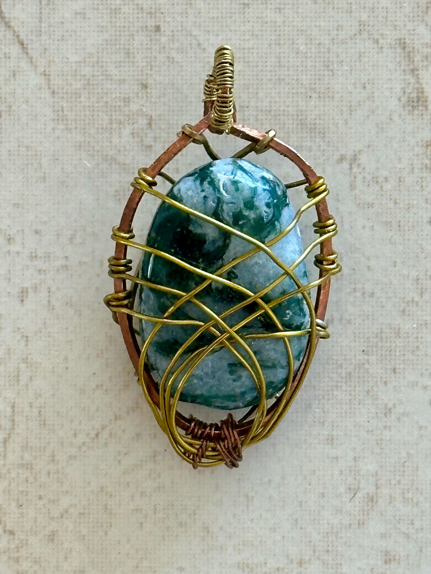 Elegant Wire-Wrapped Crystal Pebble Pendant for a Unique Statement